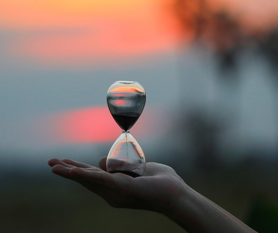 Hourglass timer in palm of hand